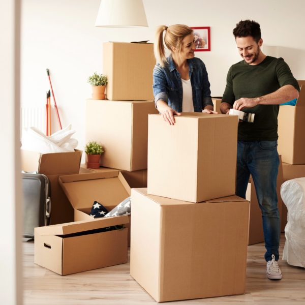 couple-packing-stuff-among-plenty-cardboard-boxes